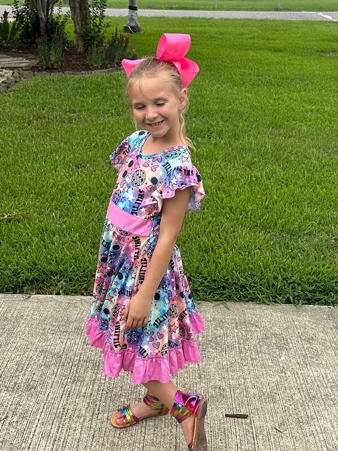 Singer Rainbow Bow Back Twirl Dress
