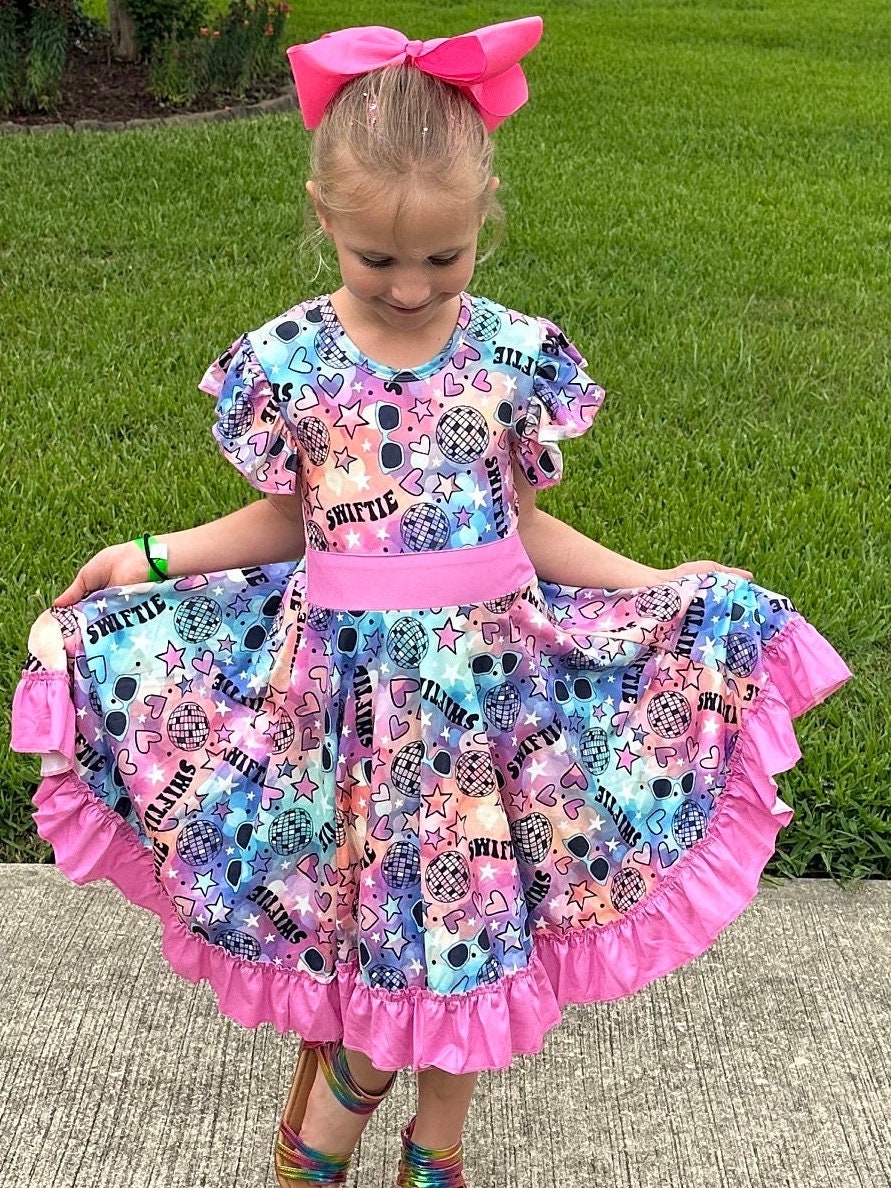 Singer Rainbow Bow Back Twirl Dress