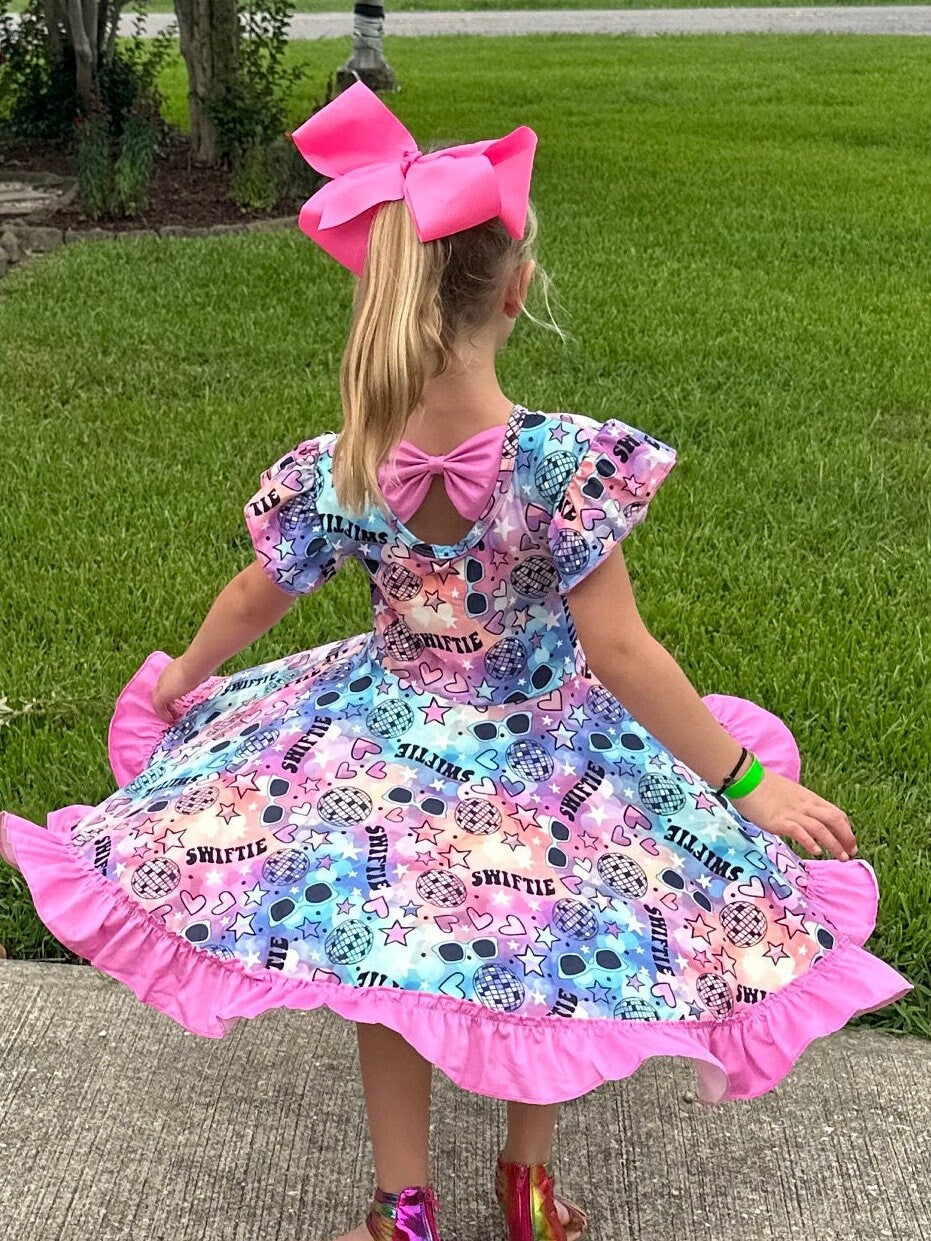 Singer Rainbow Bow Back Twirl Dress