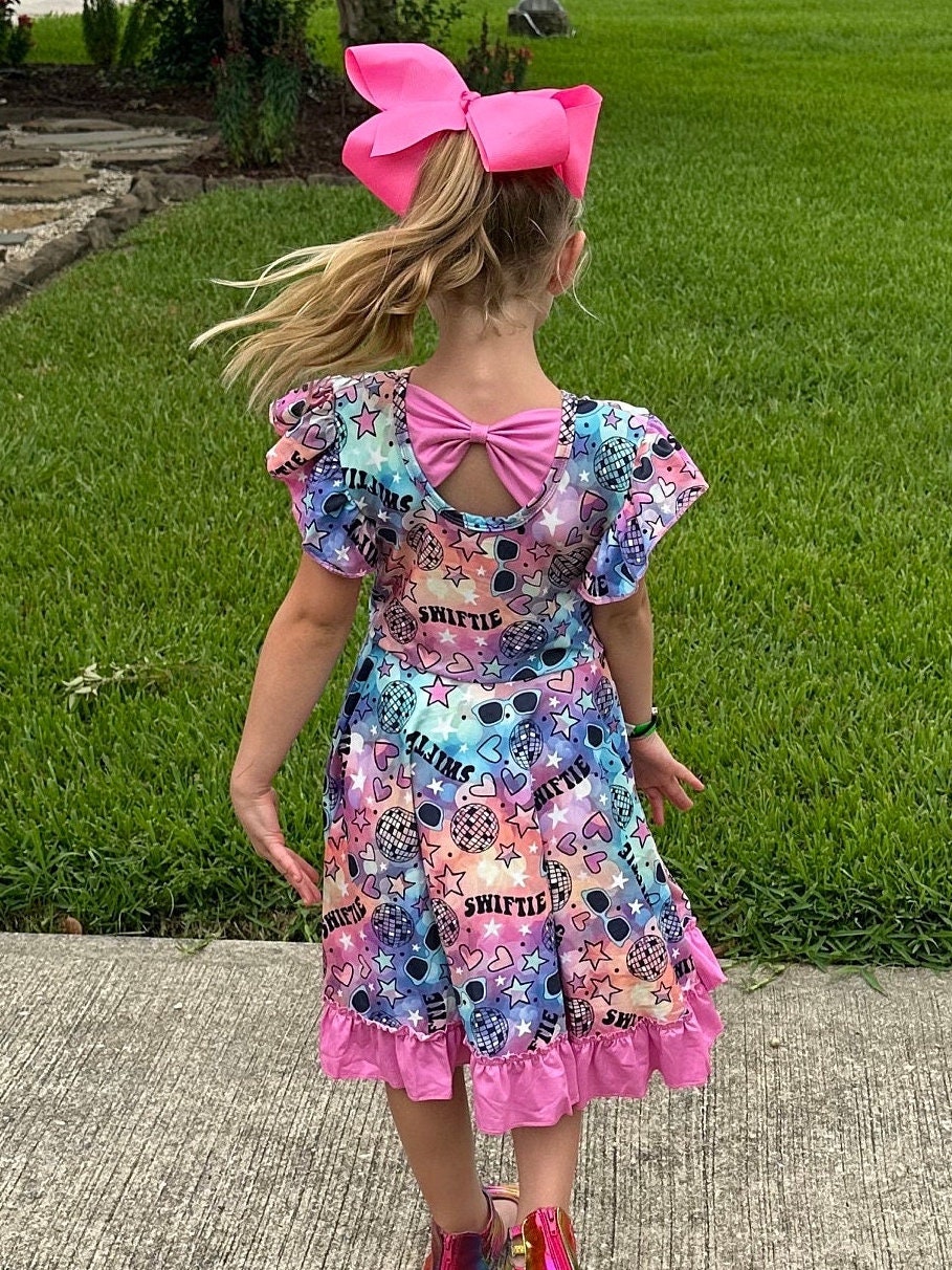 Singer Rainbow Bow Back Twirl Dress