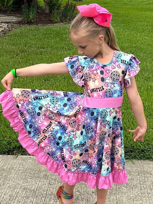 Singer Rainbow Bow Back Twirl Dress