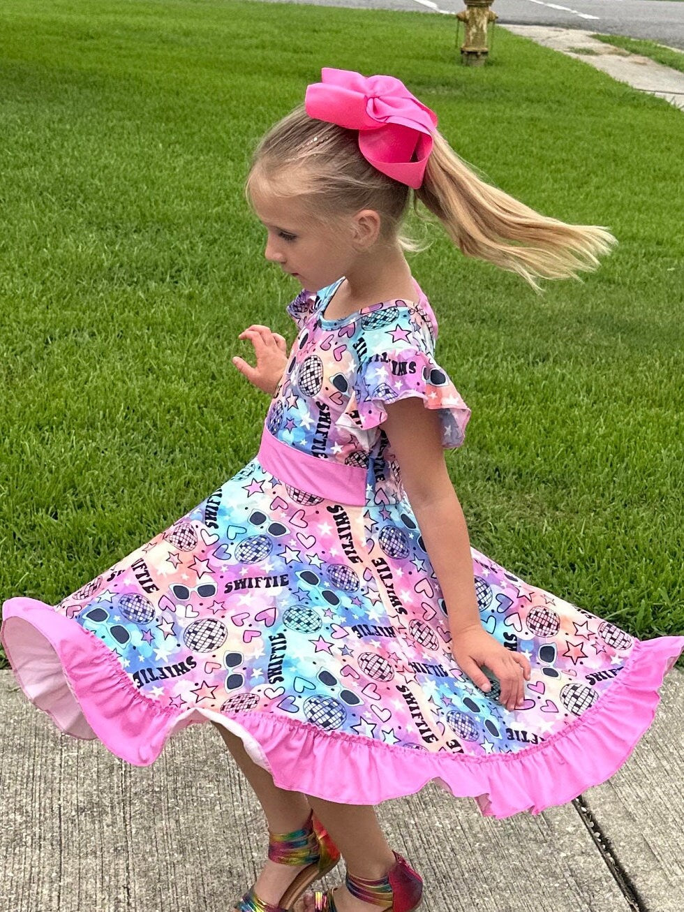 Singer Rainbow Bow Back Twirl Dress