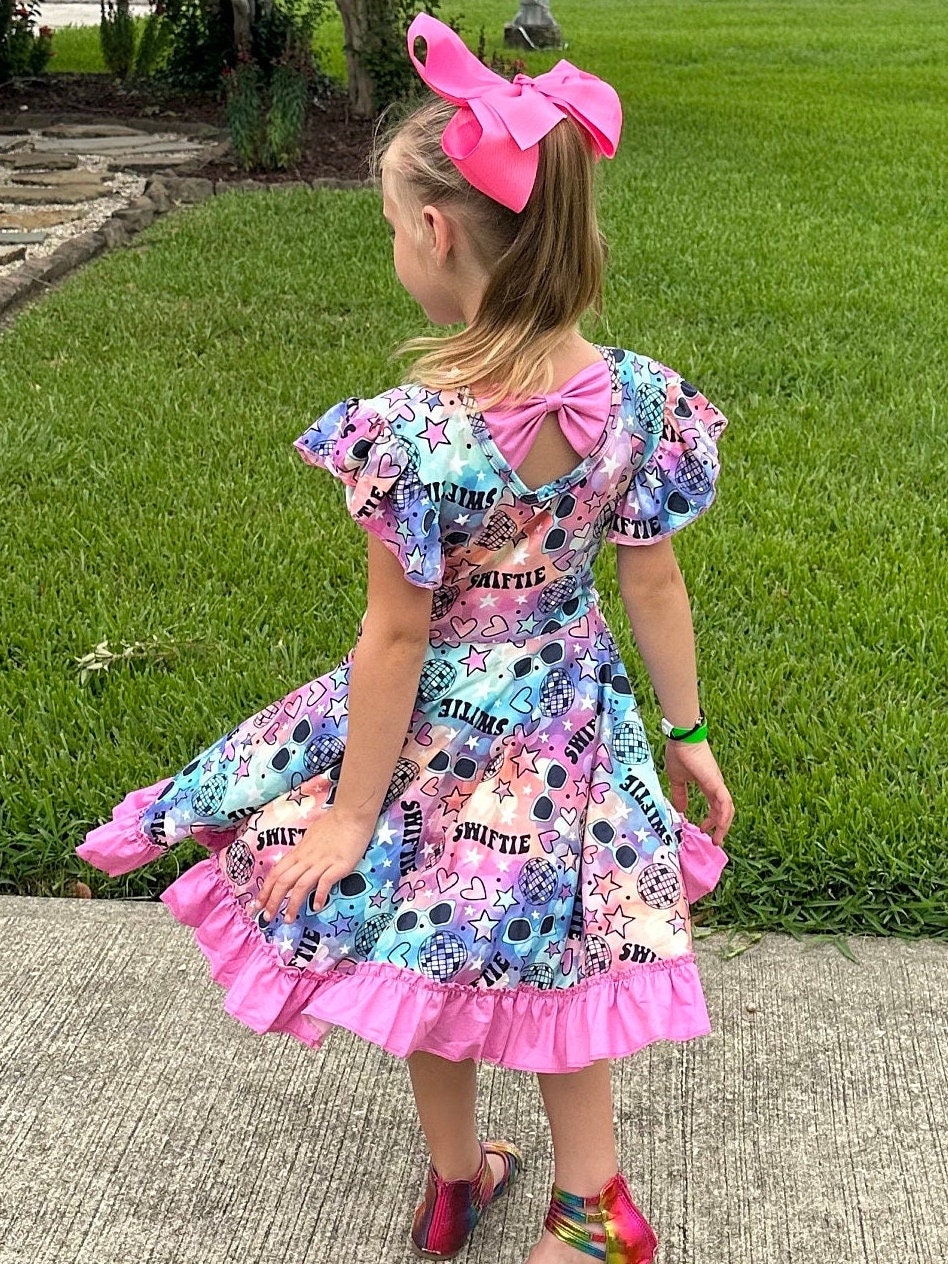 Singer Rainbow Bow Back Twirl Dress